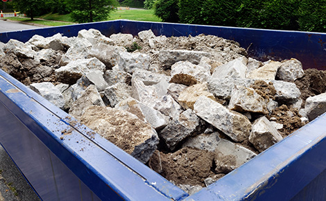 a dumpster full of old concrete.