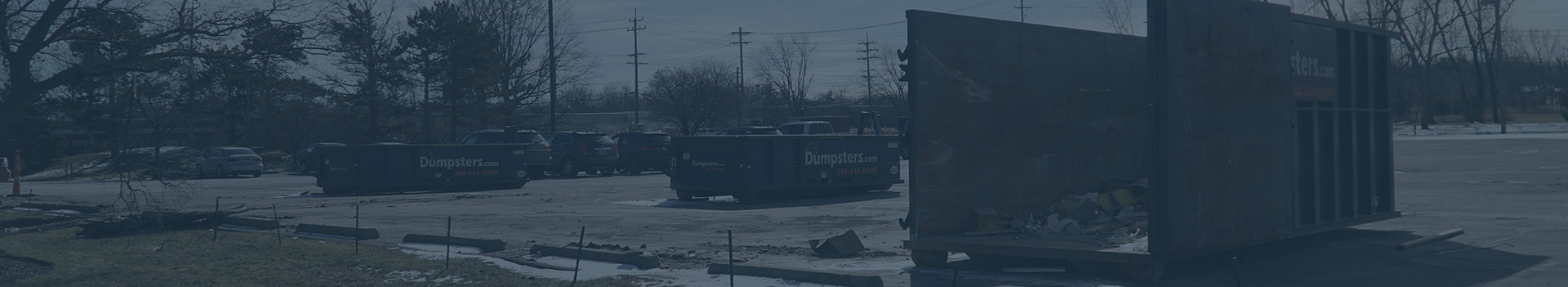 dumpster rental sitting outside in the snow