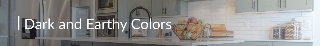 A kitchen with dark cabinets and a dark faucet