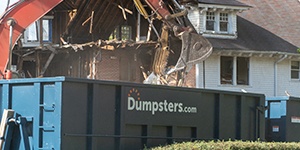 Construction Equipment Demolishing a Home.