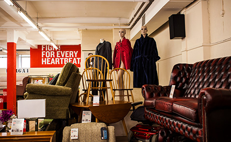 A second hand store full of old furniture and clothing. 