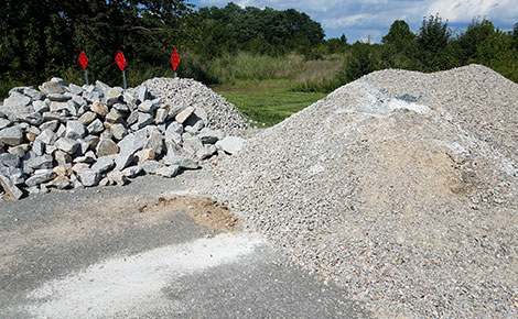 Two piles of rock and gravel to be donated.