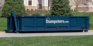 a 20 yard roll off dumpster in a driveway