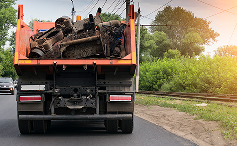 A dumpster truck full of debris. 