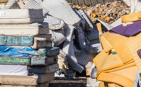 A landfill full of old mattresses. 