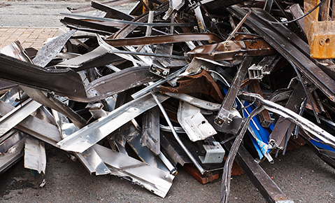 A pile of used metal bars.