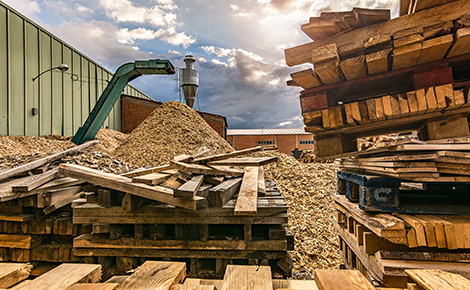 Stacks of lumber in a yard to be recycled.