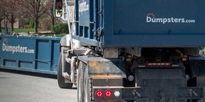 A Dumpsters.com Roll Off Dumpster on a Truck.