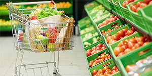 grocery cart full of fruit and vegetables