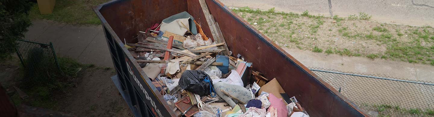 A Pile of Debris in a Roll Off Dumpster.