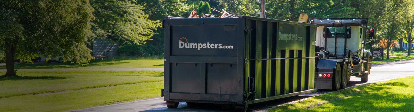 Remodeling Debris in a Dumpsters.com Roll Off Dumpster Placed on a Street.