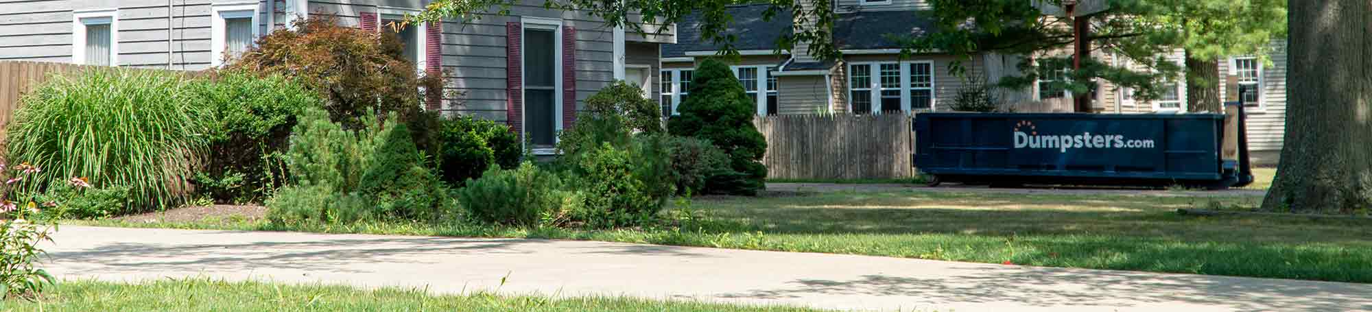 A Roll Off Dumpster in a Residential Driveway.