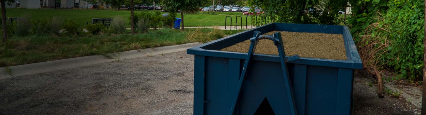 Roll Off Dumpster Filled With Dirt