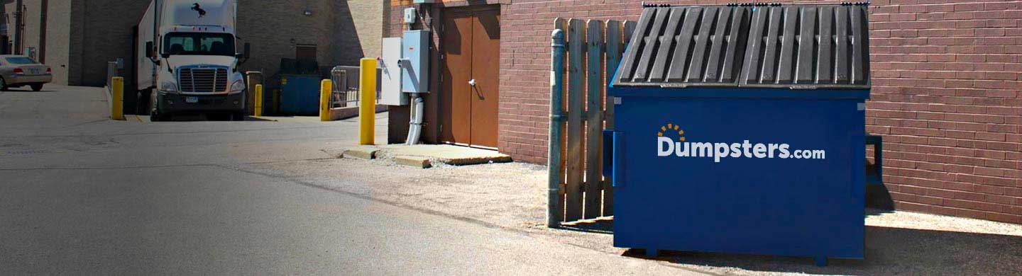 6 Cubic Yard Dumpster in a Commercial Parking Lot