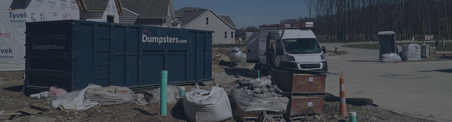 A Dumpsters.com Roll Off Dumpster On-Site at a Home Build.