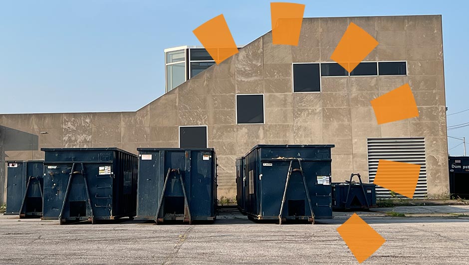 Three Blue Roll Off Dumpsters in an Industrial Jobsite