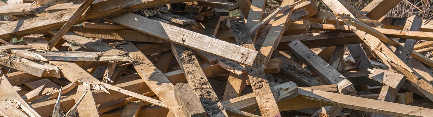A pile of untreated and treated lumber for disposal, sale and donation.