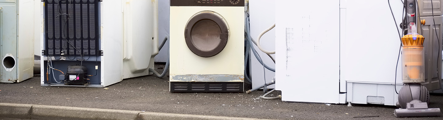 Kitchen appliances sitting outside.