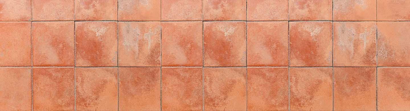 Burnt orange flooring tiles.