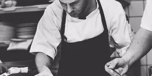 Restaurant cook preparing food.