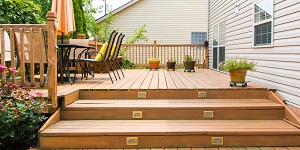 A Wooden Deck Behind a Home.