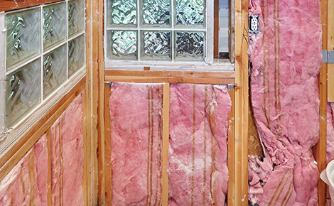 Insulation installed inside unfinished walls of house remodel.