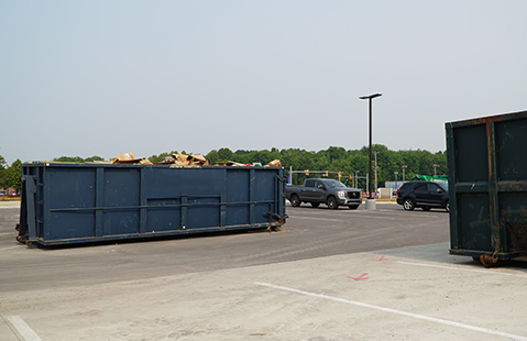 Two Men With Dumpster Truck
