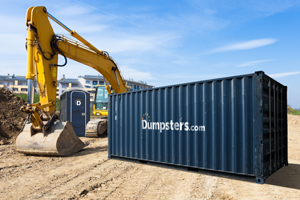 A Dumpsters.com storage container and portable toilet on an active construction site.