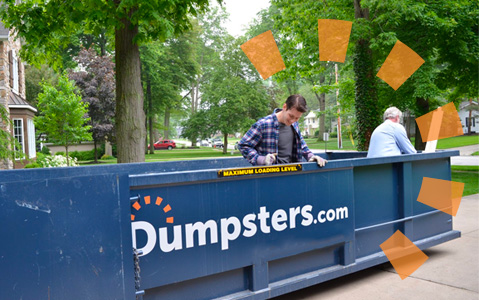 two men loading a blue dumpsters.com dumpster