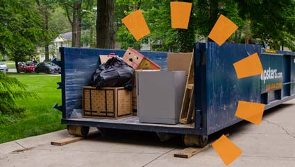 Debris loaded in roll off dumpster