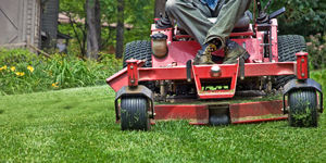 A zero turn mower cutting grass