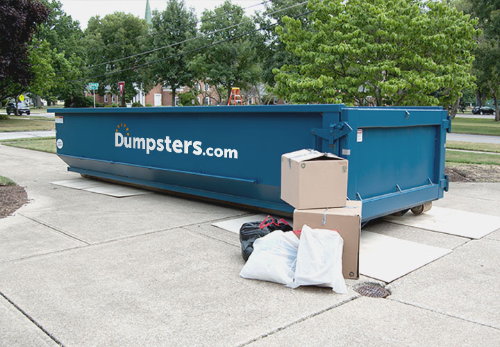 Roll Off Dumpster Being Used to Haul Away Assorted Debris.