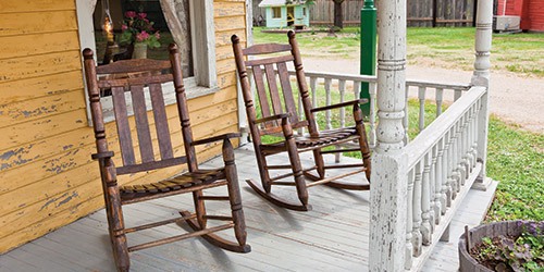  An old wooden porch with rocking chairs