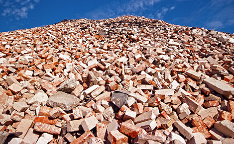 Large pile of different types of bricks.