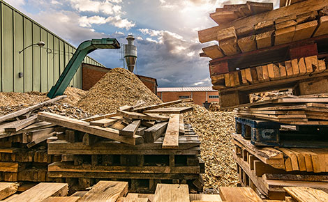 Old pallets being recycled into wood pellets.