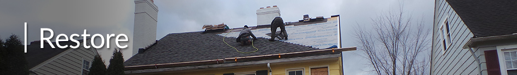 Contractors Working to Repair the Roof of a Historic Home.