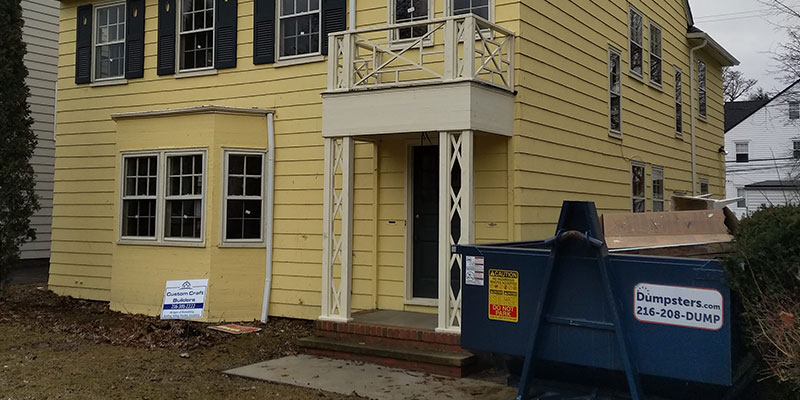 Restored Historic Home with New Paint, Siding and a Dumpsters.com Dumpster by the House.