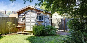 A Wooden Shed in a Backyard.
