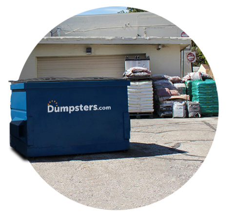 circle image of a dumpster next to a garage and industrial packages