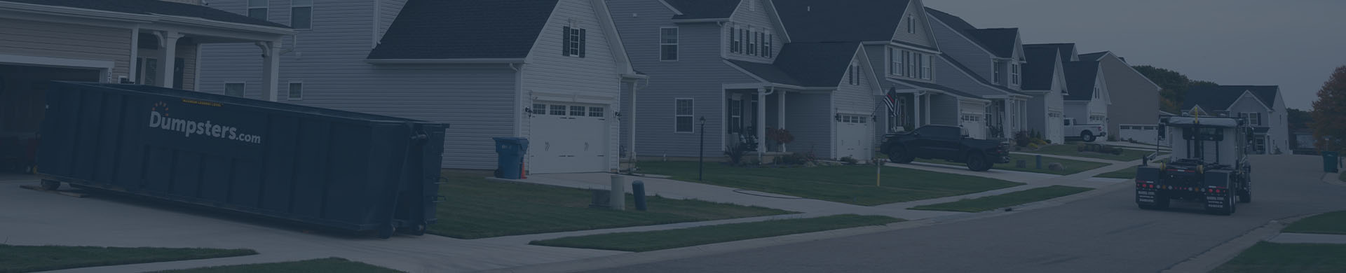 Roll off dumpster in a residential driveway. 