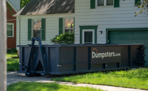 Roll Off Dumpster Sitting in a Residential Driveway