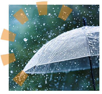 A black open umbrella being used in the rain.