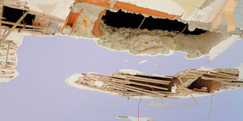 Plaster Removed From a Wall Exposing Lath.