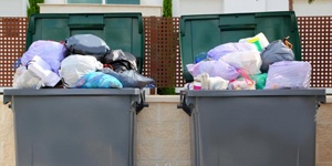 Trash Cans Overflowing With Garbage.